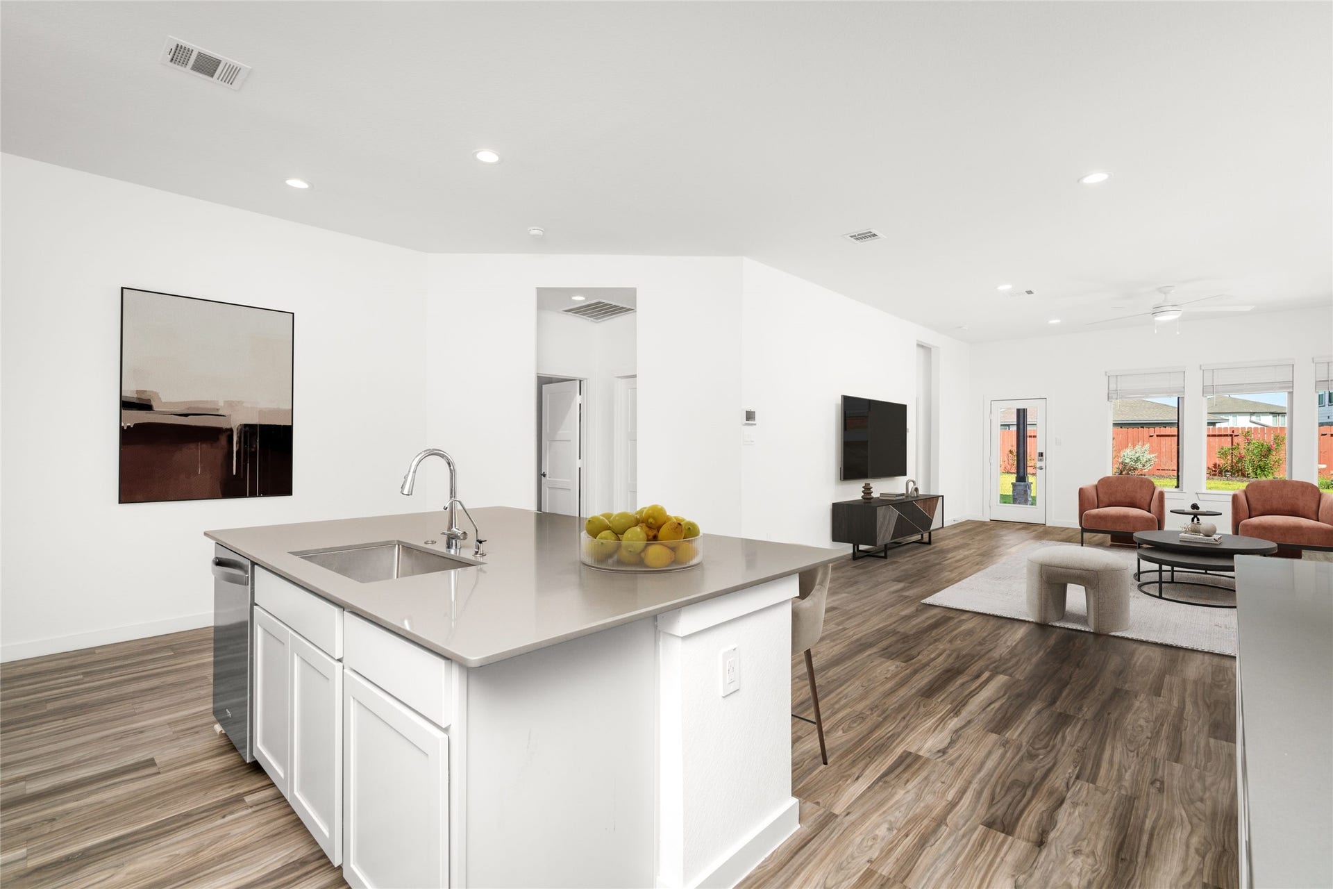 22514 Loreto Costa Lane, Katy, TX 77449 Open concept living, dining, and kitchen. Picture has been virtually staged.