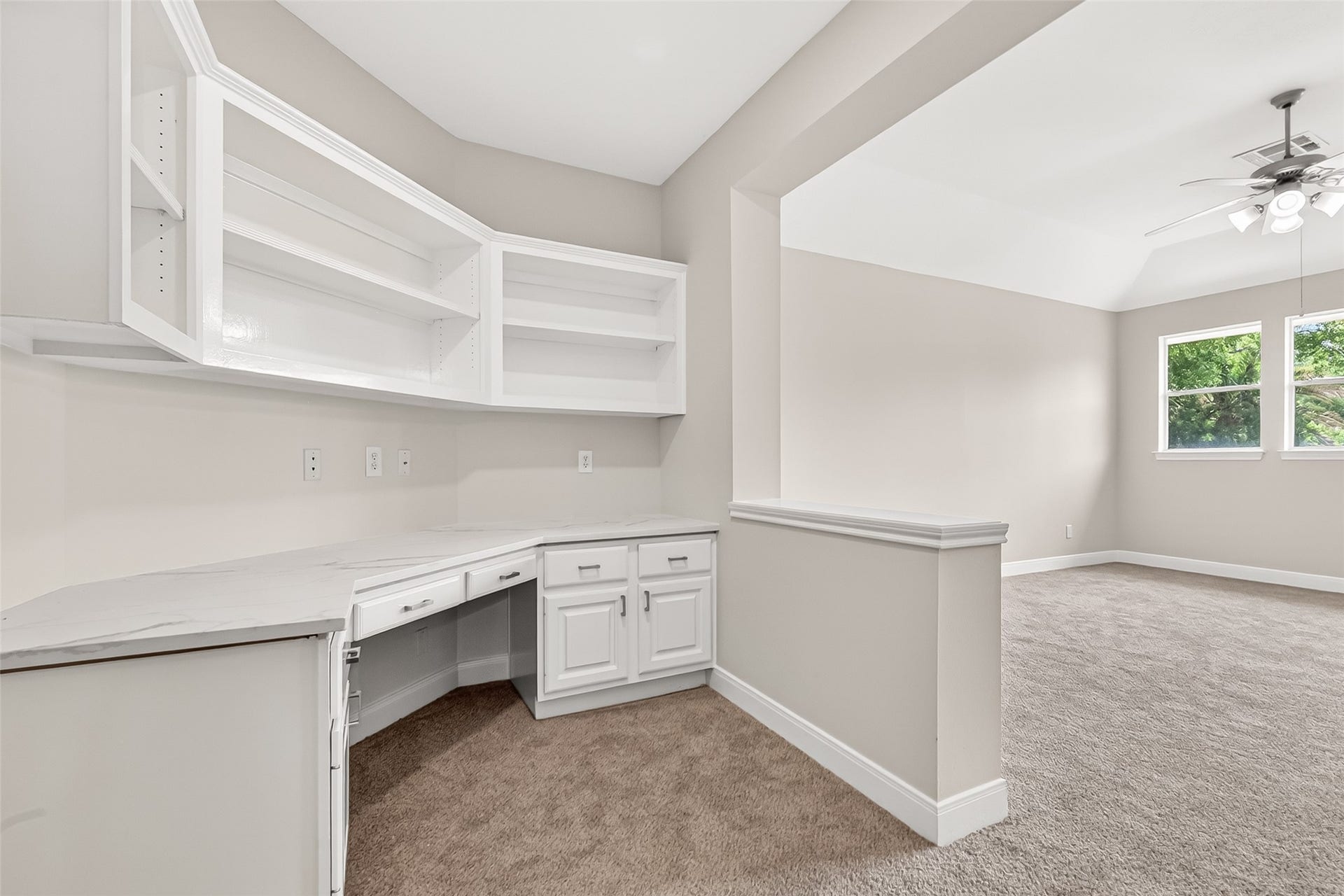 3610 Forest Row Drive, Houston, TX 77345 Bright and versatile space featuring built-in shelves and cabinets, ideal for a home office or study nook.