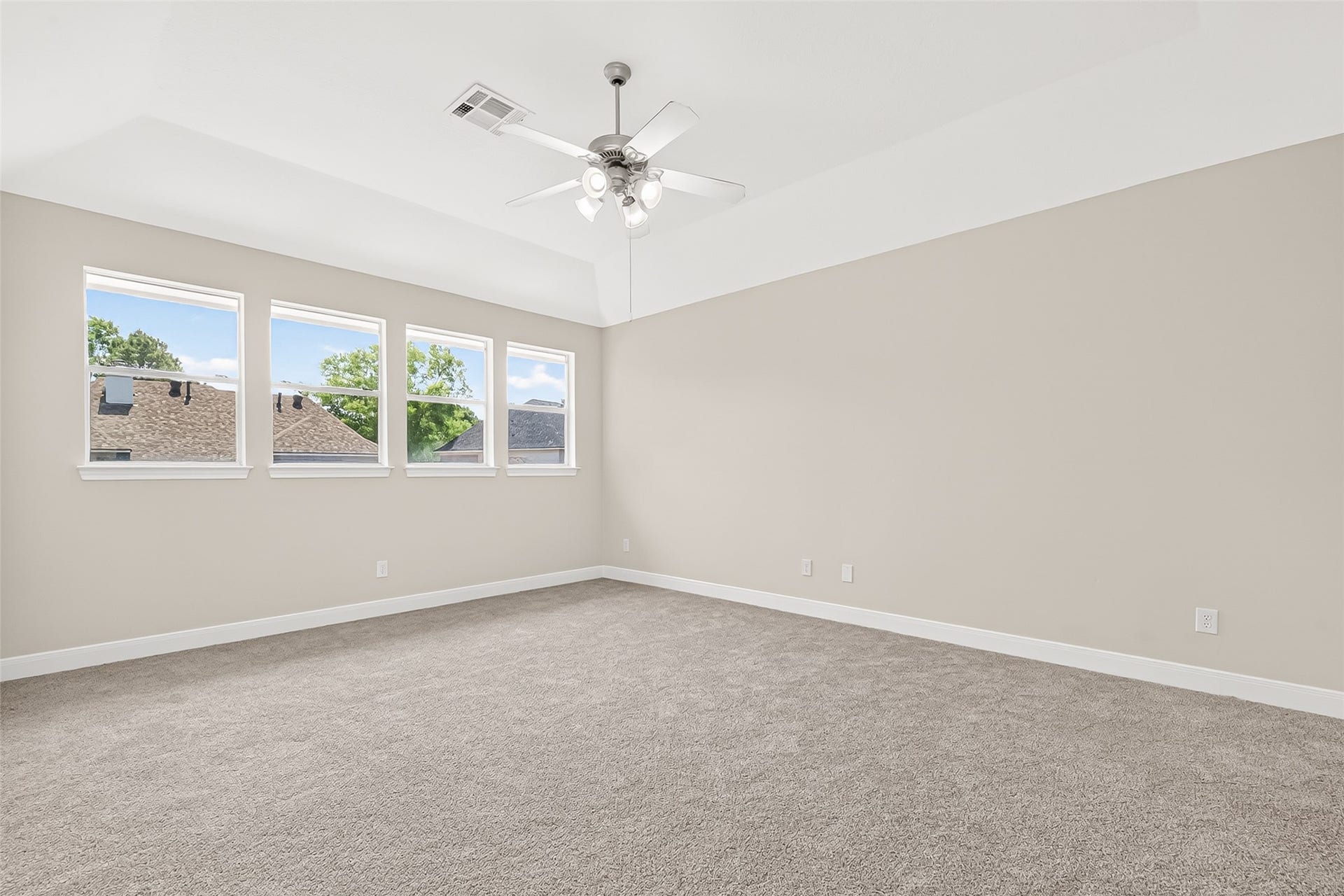 3610 Forest Row Drive, Houston, TX 77345 Spacious and bright room featuring plush carpeting, a stylish ceiling fan, and large windows that invite natural light.