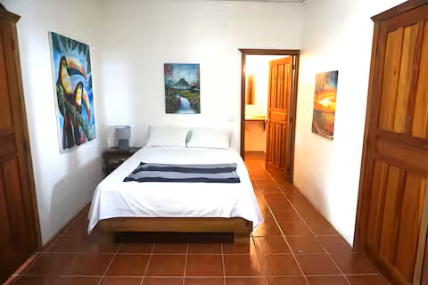 Matapalo Estate home with sunset ocean views and a waterfall — photo 8 of 19
