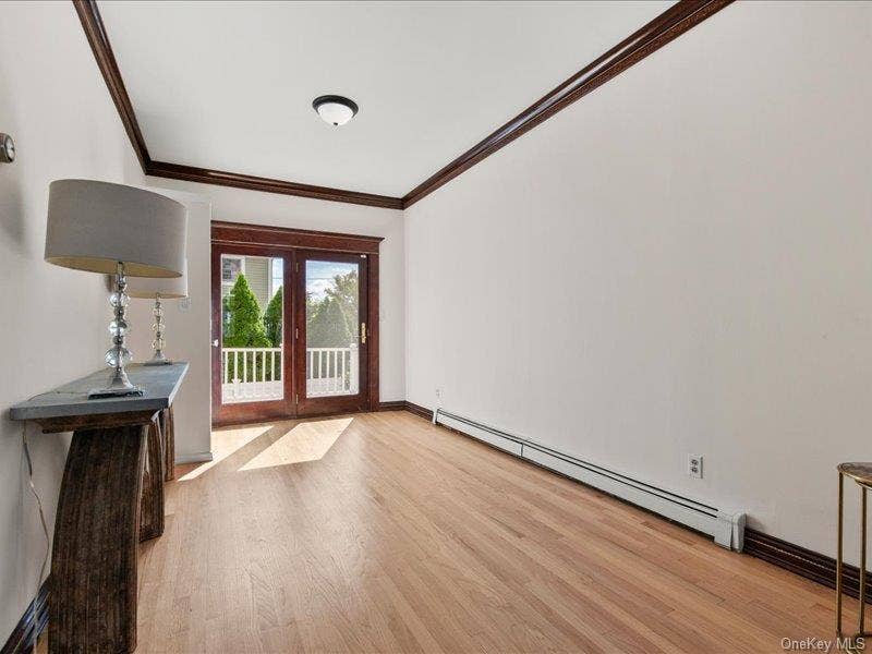 39 12th Avenue, Sea Cliff, NY 11579 Spacious living room opens to dining room. with glass doors to rear deck