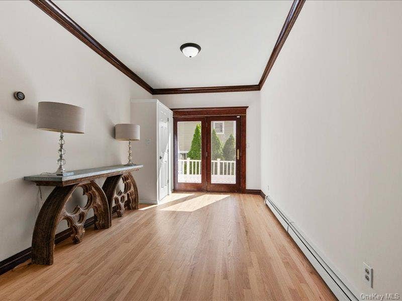 39 12th Avenue, Sea Cliff, NY 11579 Spacious living room opens to dining room. with glass doors to rear deck