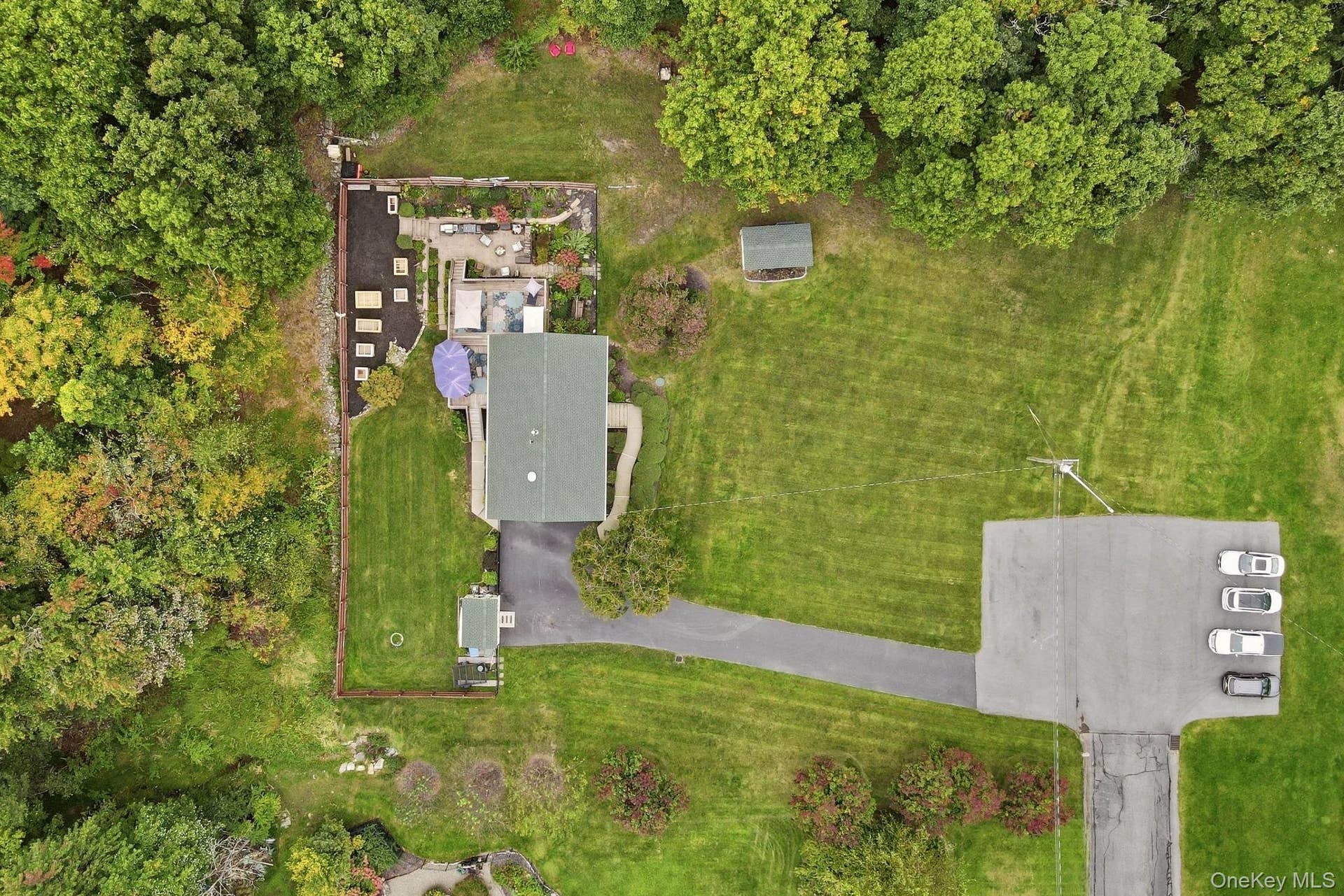 161 Highland Avenue, Monroe, NY 10950 A wider perspective highlights the home's setting and surrounding grounds.