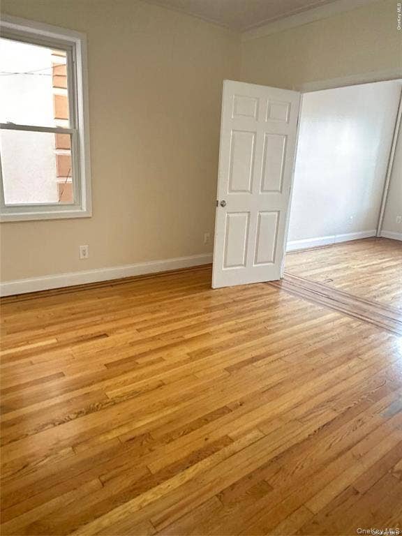 3138 103rd Street, #2ND FL, Corona, NY 11368 Hardwood flooring throughout, neutral wall tones, and white trim