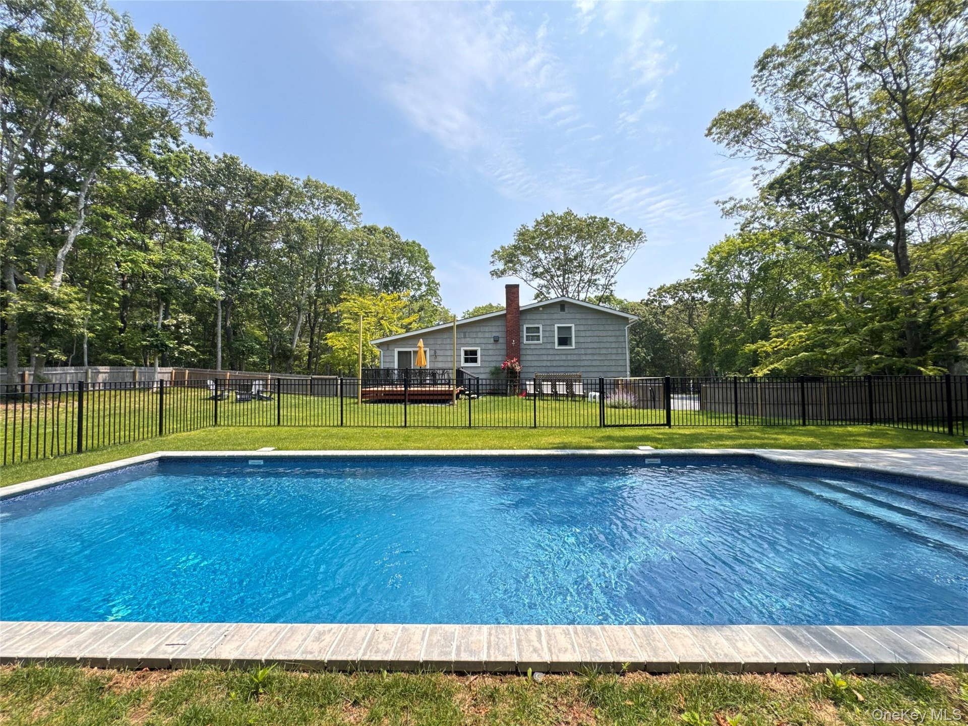 3 Debbie Trail, Hampton Bays, NY 11946 View of pool featuring a wooden deck