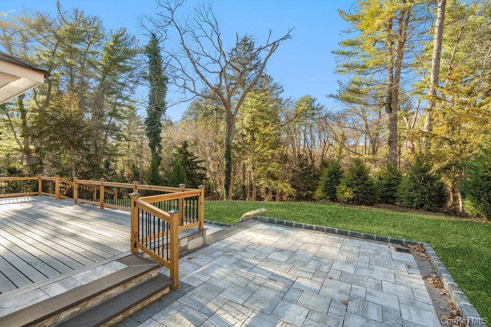 89 Mill River Road, Upper Brookville, NY 11771 Deck featuring a yard and a patio