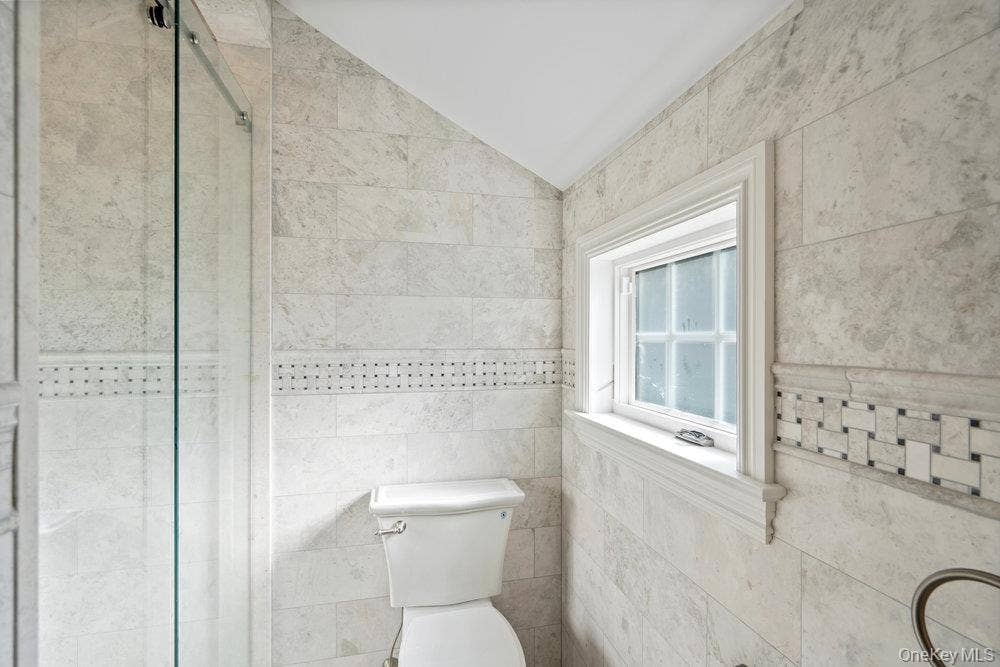 89 Mill River Road, Upper Brookville, NY 11771 Bathroom with a stall shower and lofted ceiling