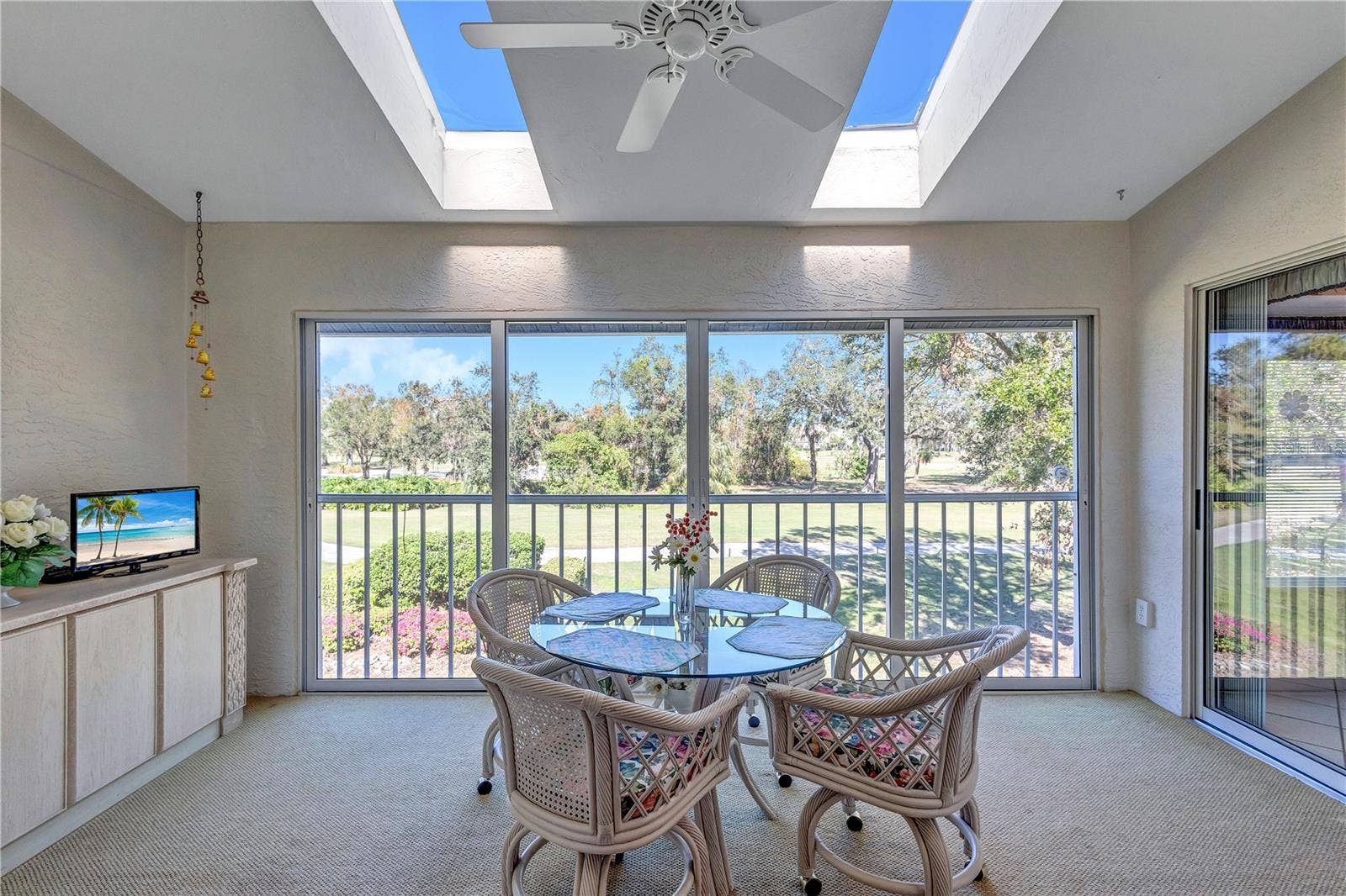 6713 STONE RIVER ROAD, #205, Bradenton, FL 34203 Bright and Cheery Skylit Back Lanai Facing the Fairway