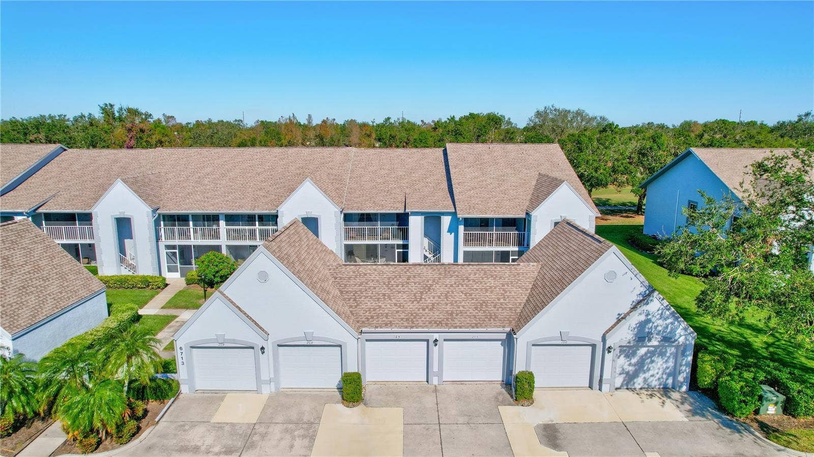 6713 STONE RIVER ROAD, #205, Bradenton, FL 34203 Building with Garage in Front #205.