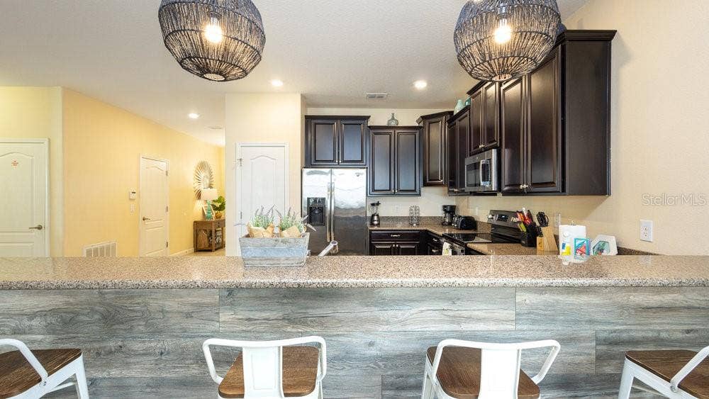 1450 ROLLING FAIRWAY DRIVE, Davenport, FL 33896 Living To Kitchen