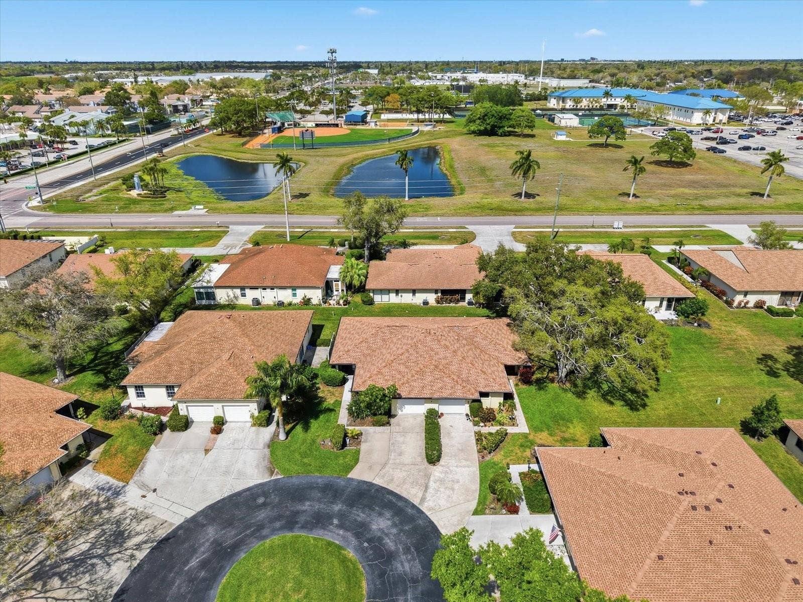 Home to your right. Left villa w/extra-wide drive.