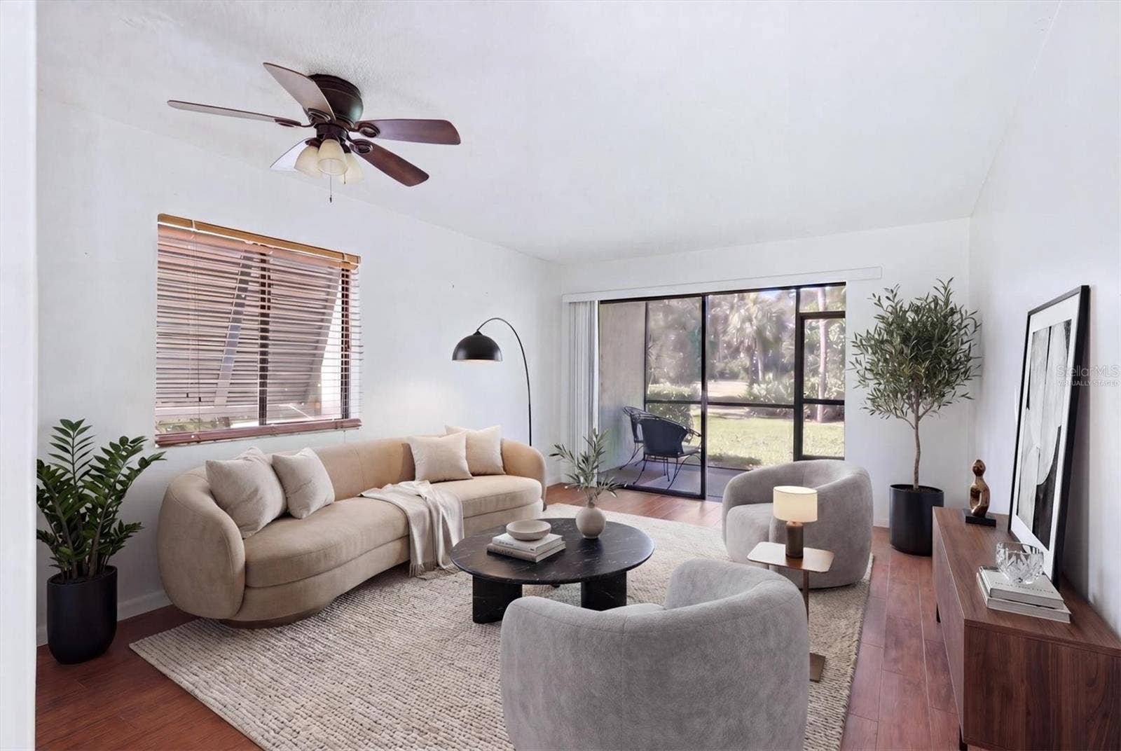 4528 LONGWATER, #35, Sarasota, FL 34235 Virtually staged to give your living room a warmer look.
