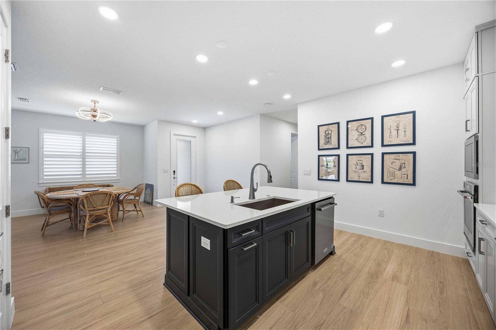 18652 DAYSPRING PLACE, Venice, FL 34293 View of the entry and dining area from the kitchen