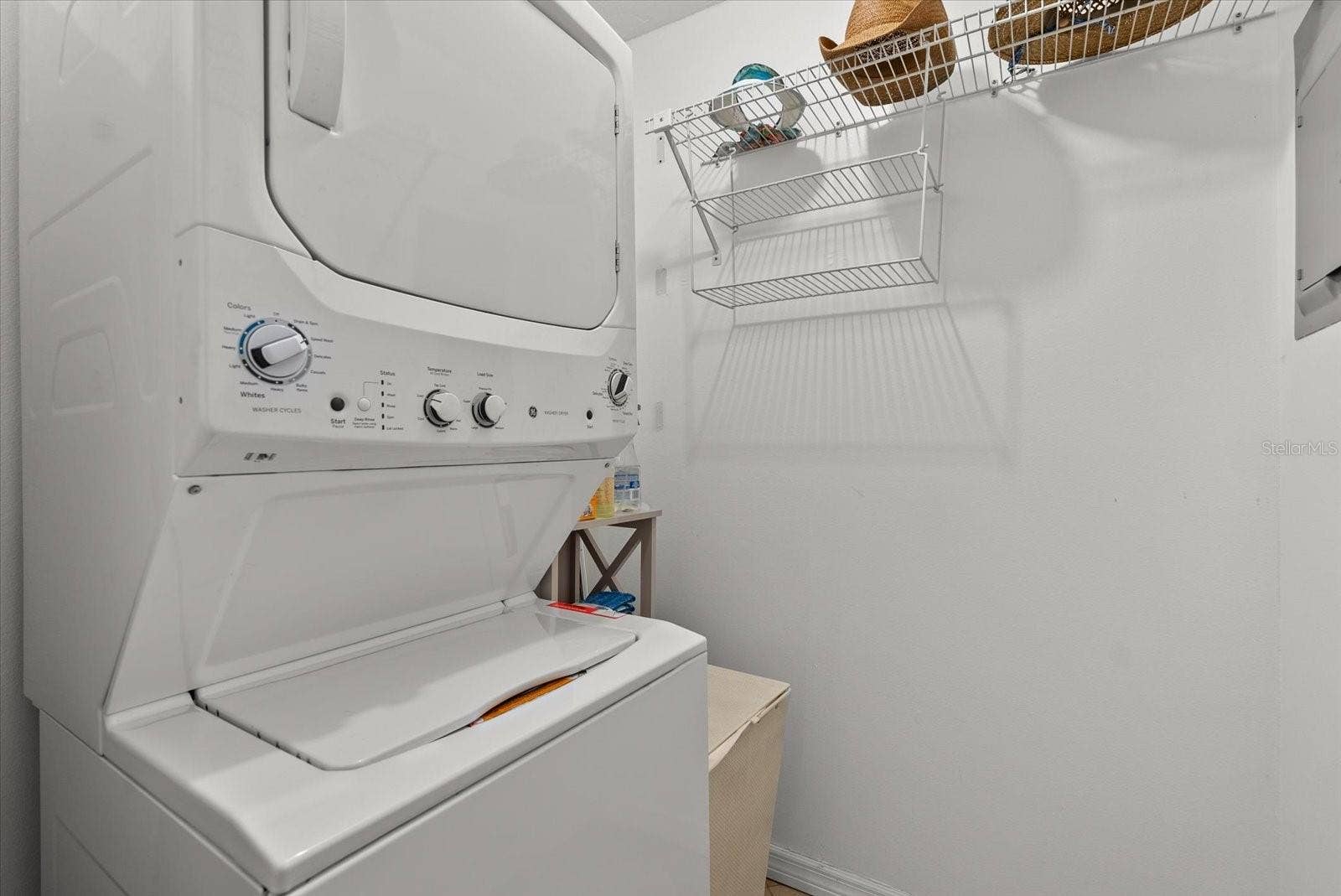 2723 60TH AVENUE DRIVE W, #2723, Bradenton, FL 34207 Indoor laundry room with a new stacked washer & dryer.
