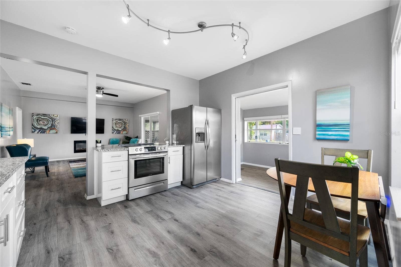 5044 BETTY STREET N, St Petersburg, FL 33709 Modern kitchen with granite counters & breakfast bar