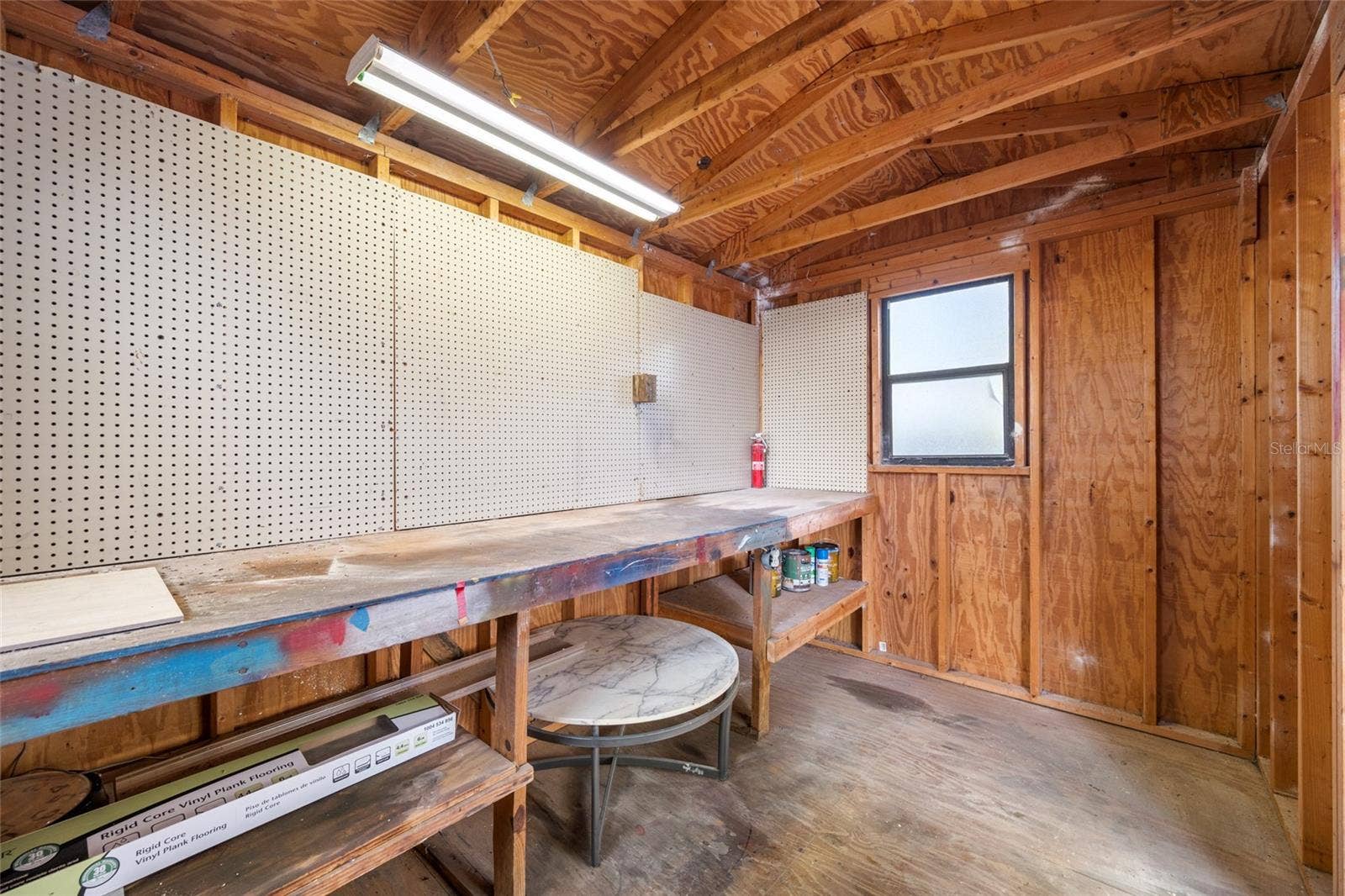 5044 BETTY STREET N, St Petersburg, FL 33709 Detached workshop with built in desk, perfect for projects and hobbies