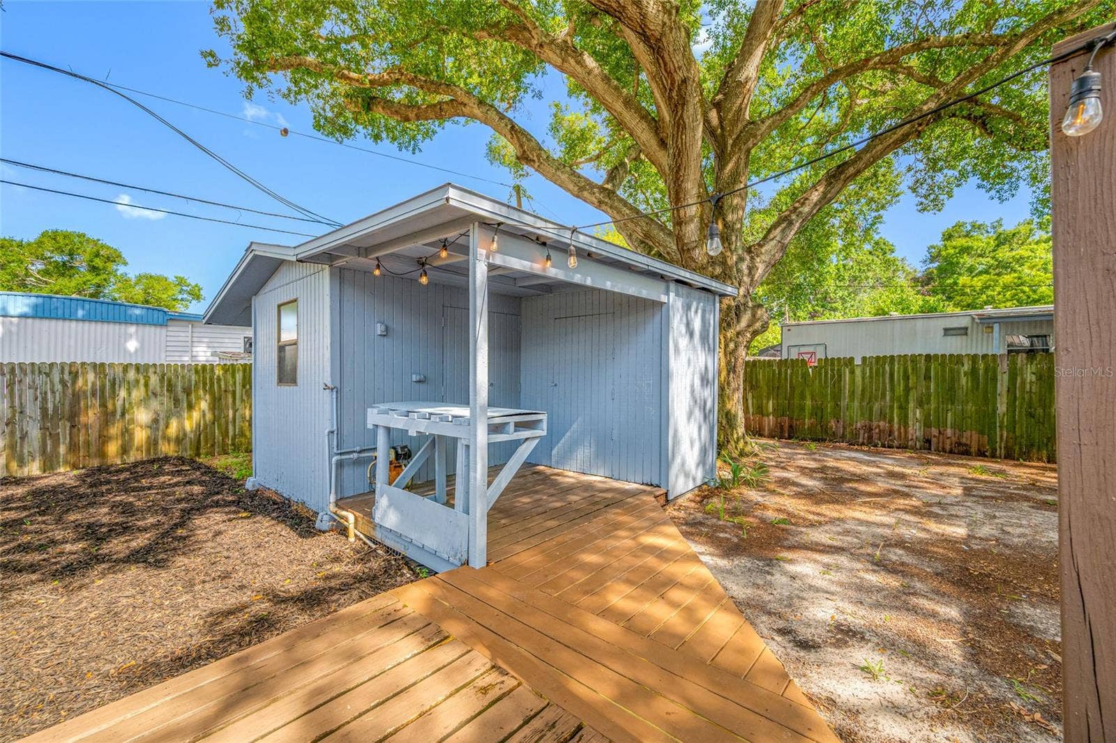 5044 BETTY STREET N, St Petersburg, FL 33709 Detached workshop with built in desk, perfect for projects and hobbies