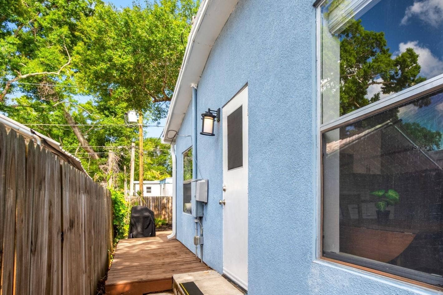 5044 BETTY STREET N, St Petersburg, FL 33709 Side door from kitchen to deck and back yard.