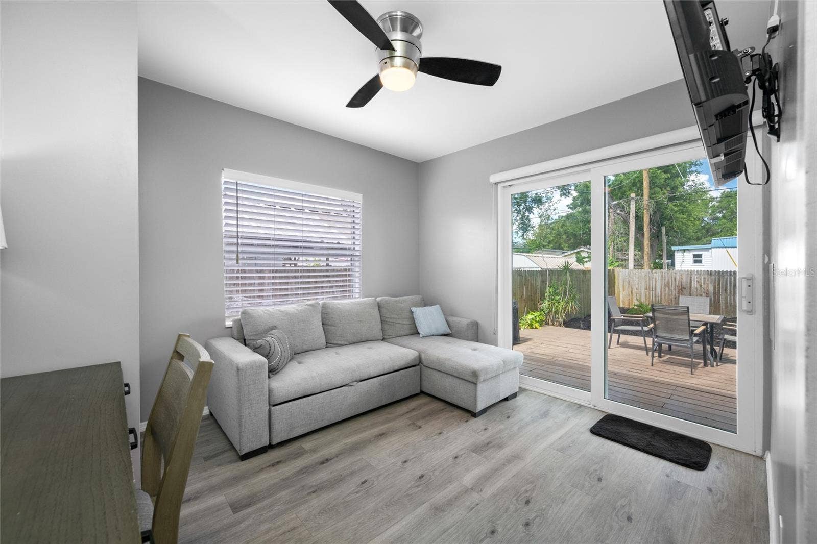 5044 BETTY STREET N, St Petersburg, FL 33709 Bedroom 3 / Office with built in closet and slider opening to the back deck.