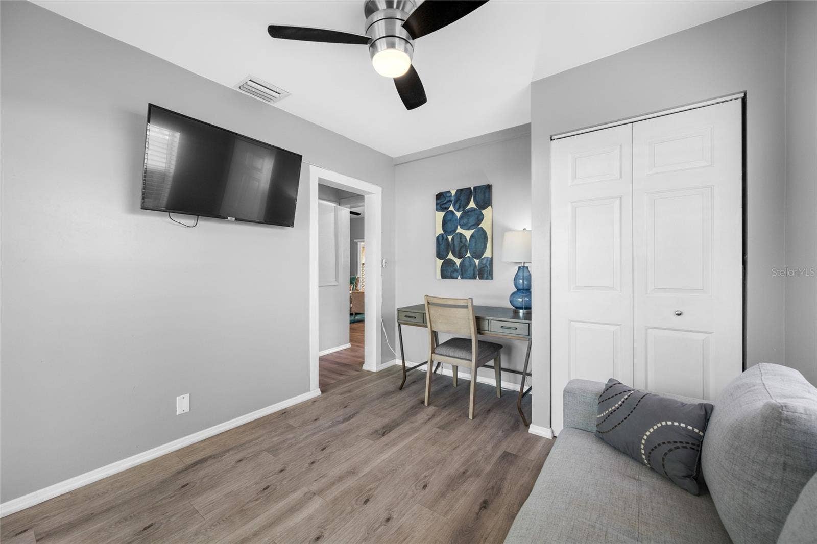 5044 BETTY STREET N, St Petersburg, FL 33709 Bedroom 3 / Office with built in closet and slider opening to the back deck.