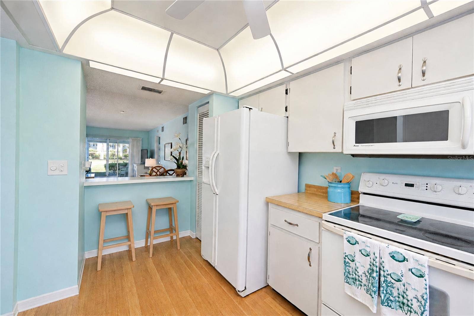 4809 INDEPENDENCE DRIVE, Bradenton, FL 34210 Kitchen from sink over breakfast bar