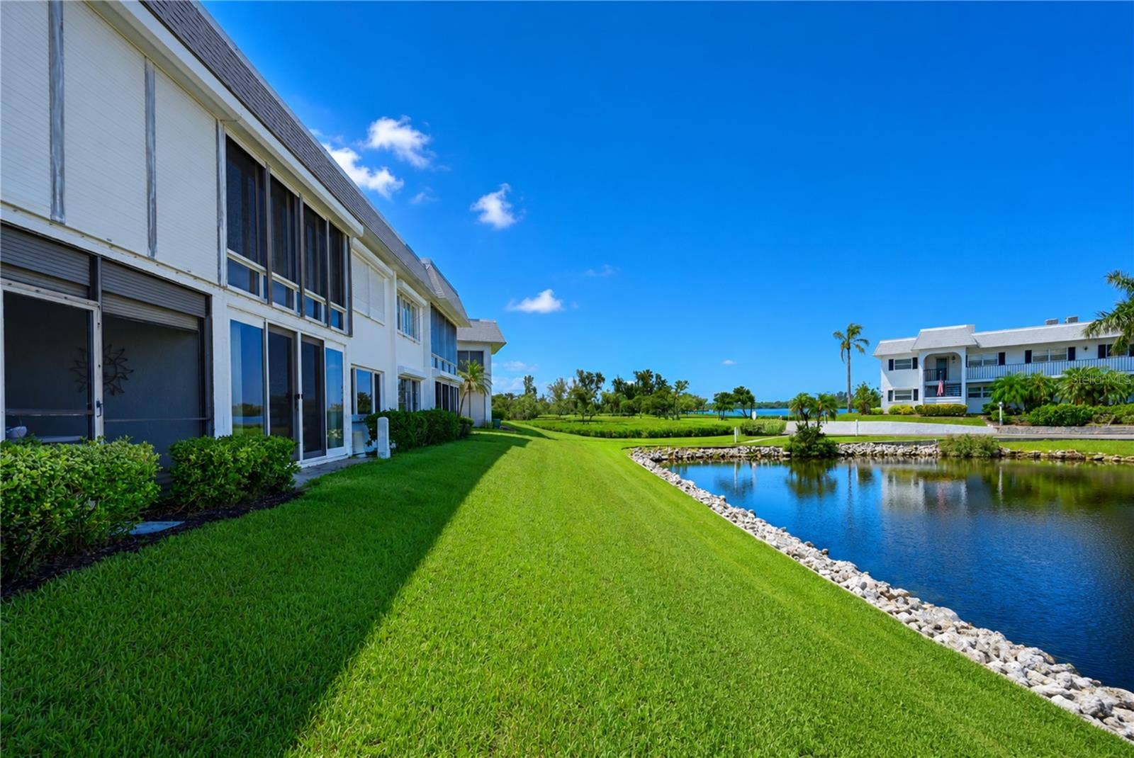 4809 INDEPENDENCE DRIVE, Bradenton, FL 34210 View across back of condo to bay front park