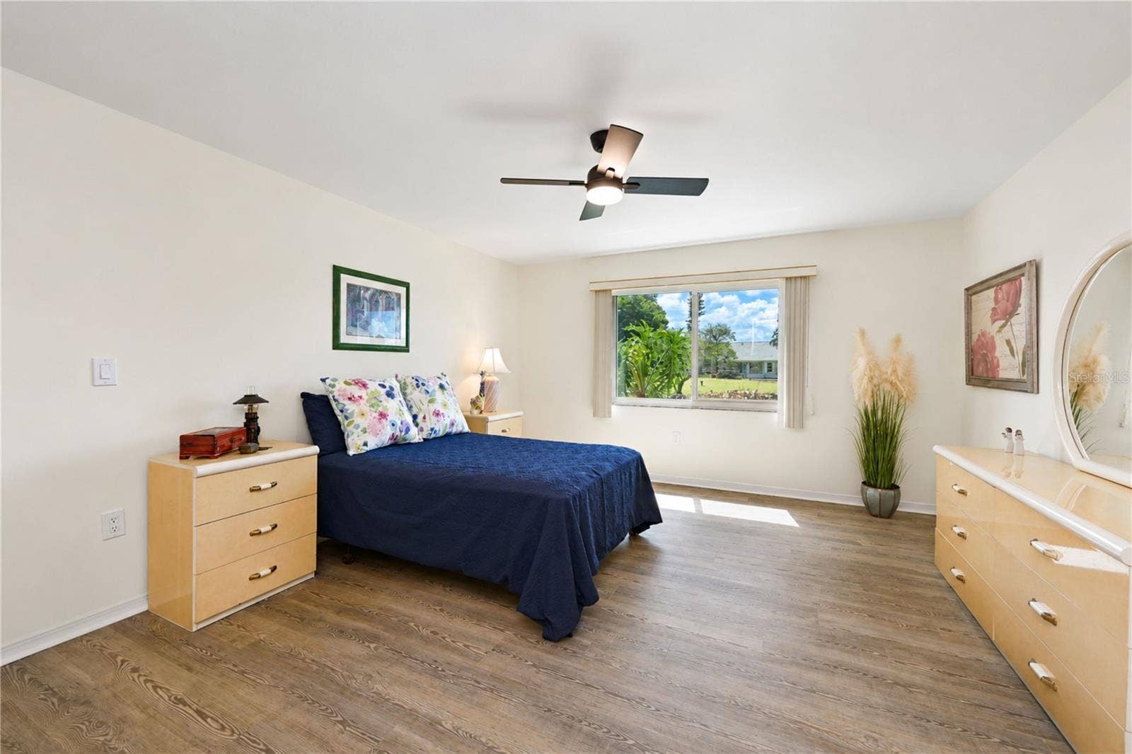 4853 INDEPENDENCE DRIVE, Bradenton, FL 34210 Primary bedroom can hold a king size suite of furniture and features plank flooring