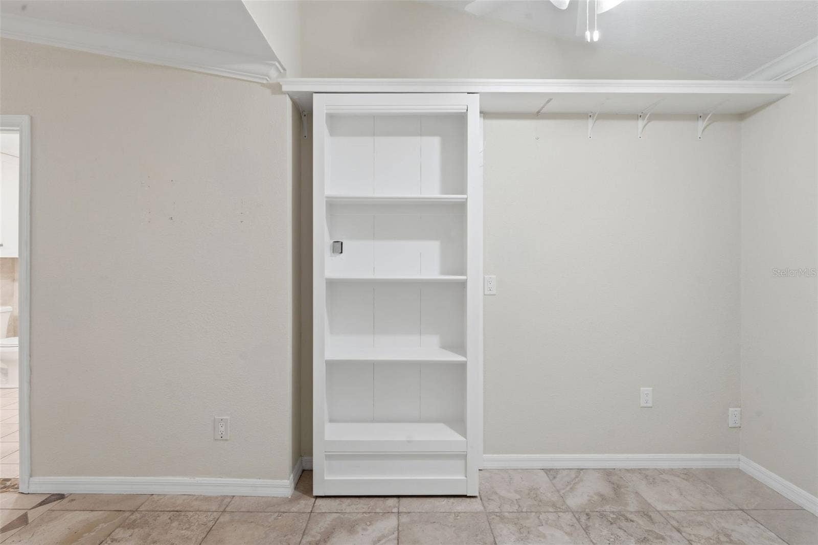 Shelf door to safe room