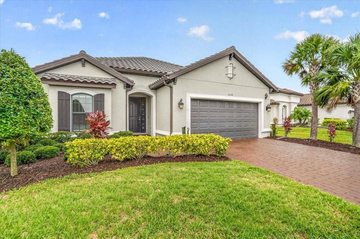 11014 WICKER PARK PLACE, Palmetto, FL 34221 Welcome to this Lazio Model (3/3 plus den)
