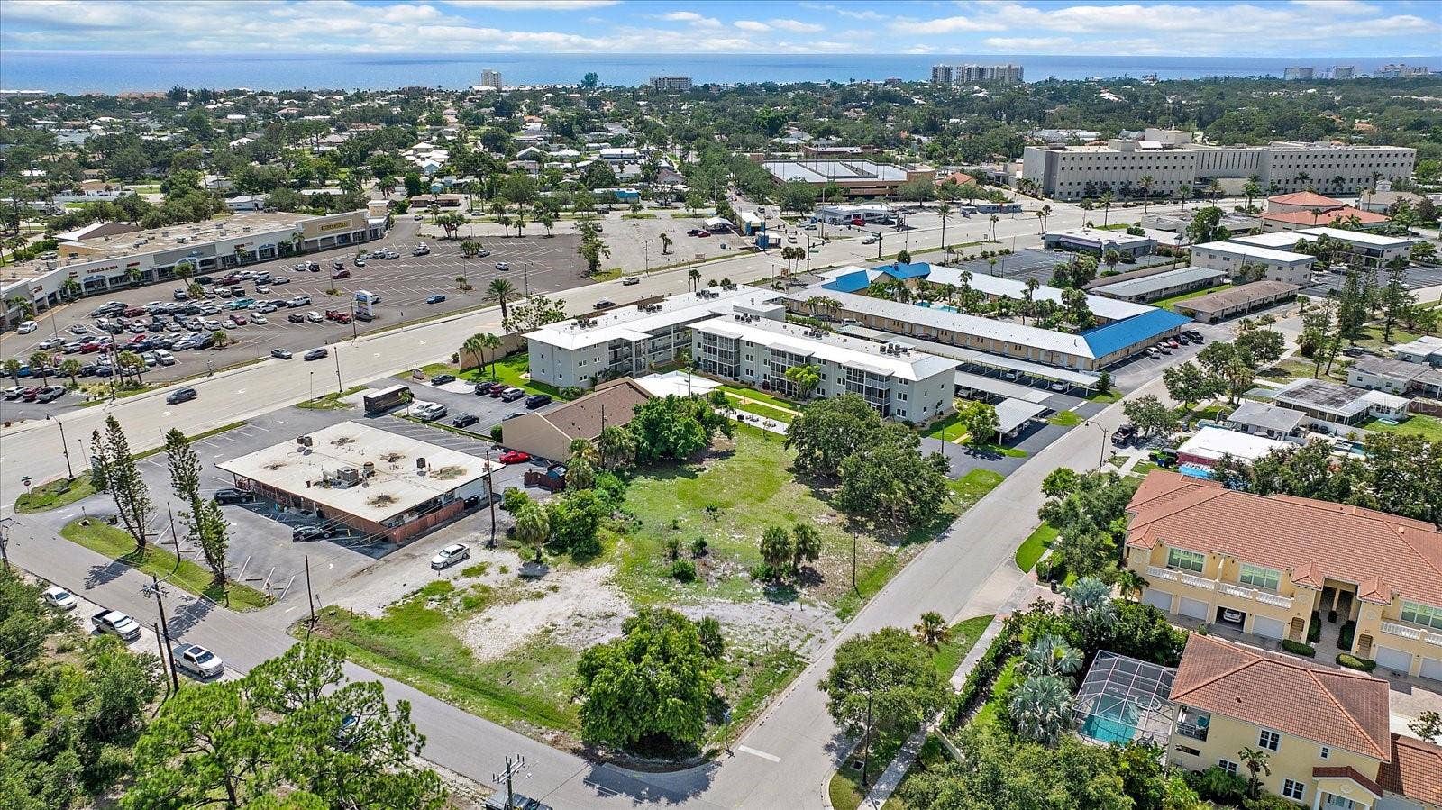 648 GUILD DRIVE, Venice, FL 34285 Aerial view of the lot with waterfront high-rises visible in the distance