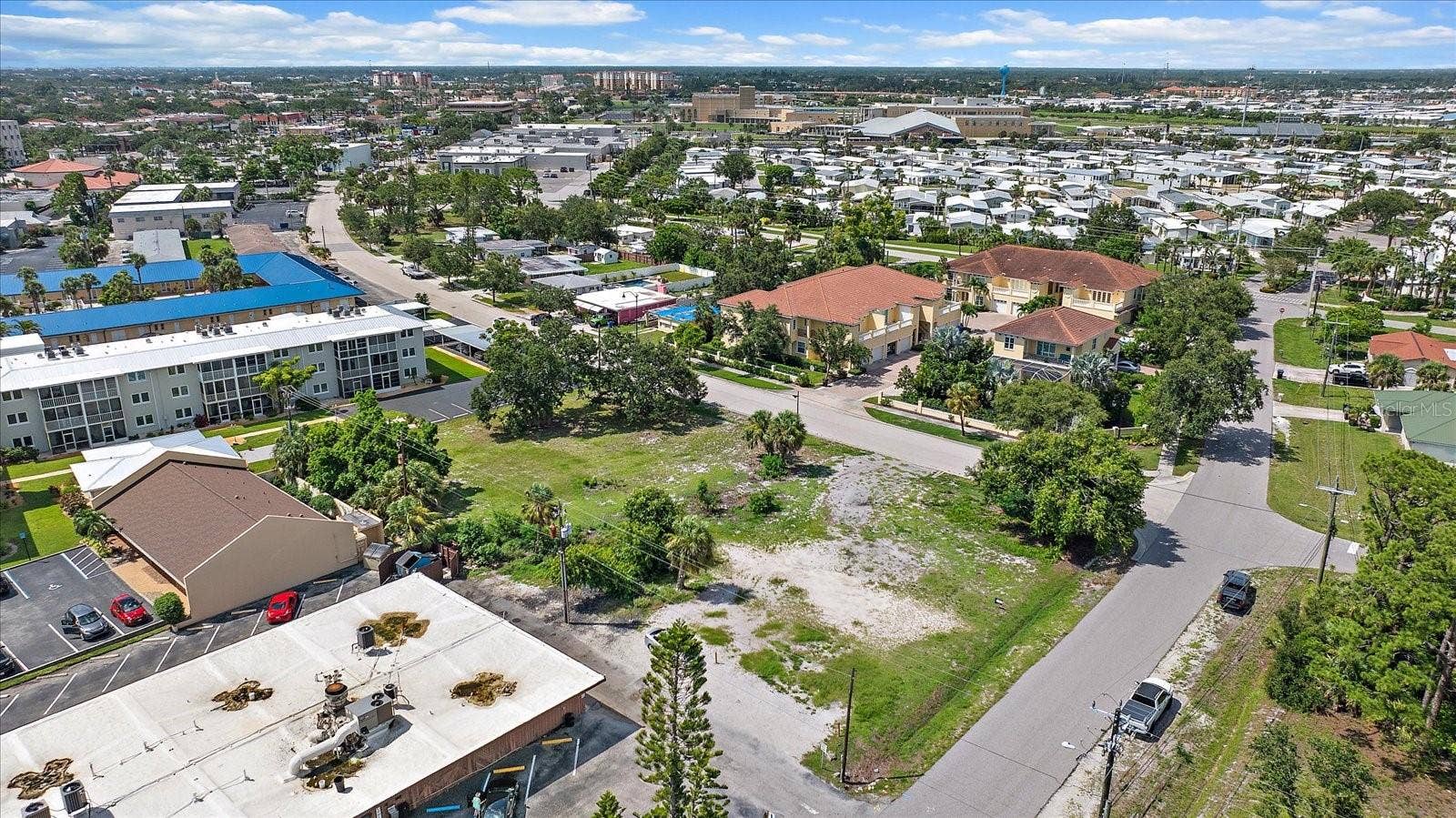 648 GUILD DRIVE, Venice, FL 34285 Aerial view of the lot with downtown skyline in the distance