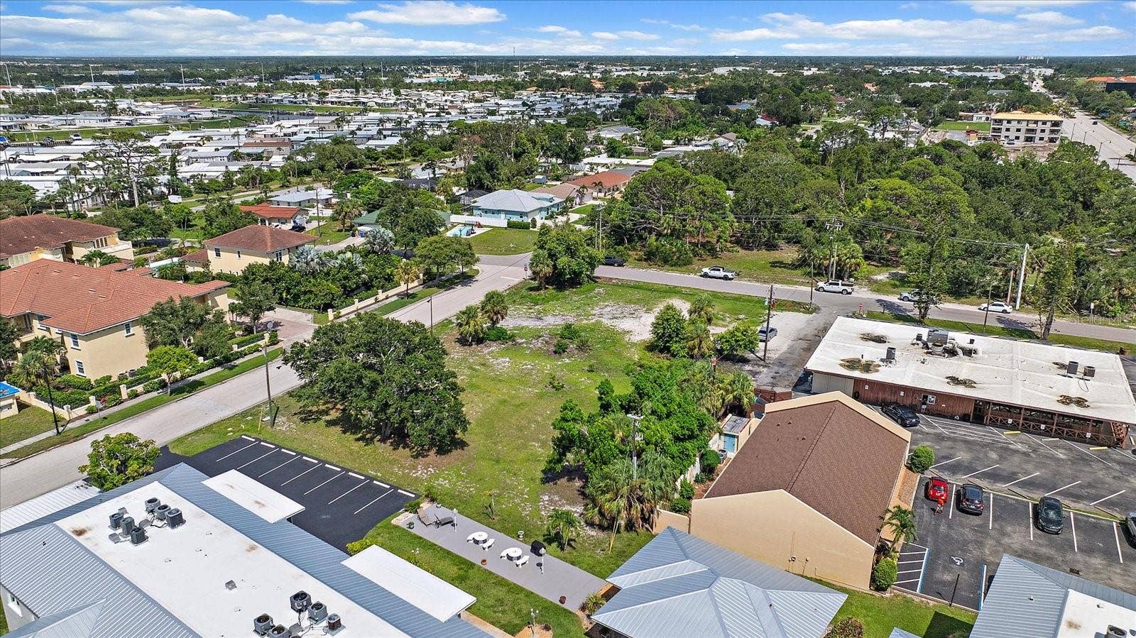648 GUILD DRIVE, Venice, FL 34285 Aerial view of the lot overlooking the surrounding residential neighborhood