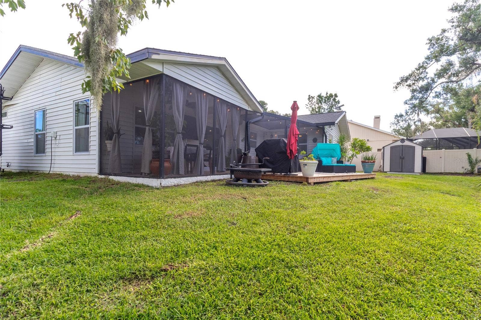 7905 55TH STREET E, Palmetto, FL 34221 BACKYARD WOOD DECK, FIREPIT AREA & SCREENED LANAI