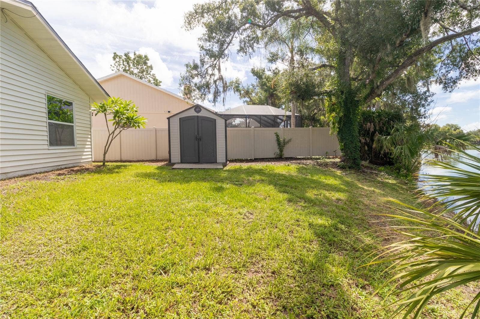 7905 55TH STREET E, Palmetto, FL 34221 BACKYARD PHOTO FROM DOCK