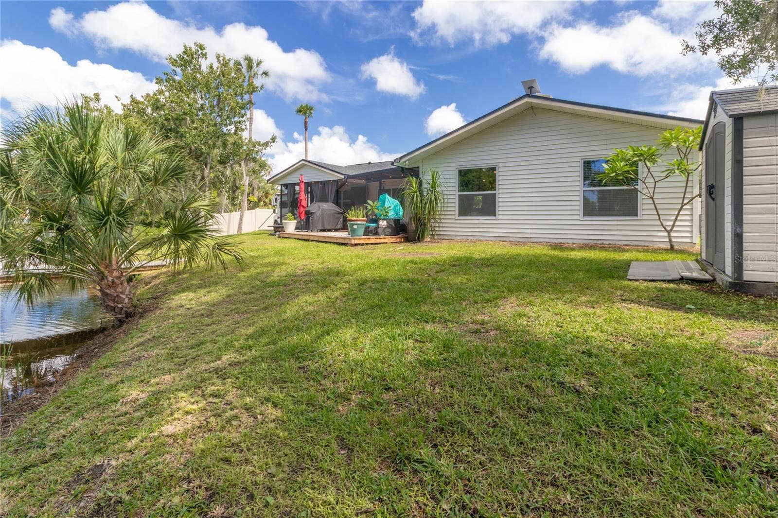 7905 55TH STREET E, Palmetto, FL 34221 BACKYARD W/WOOD DECK & STORAGE SHED