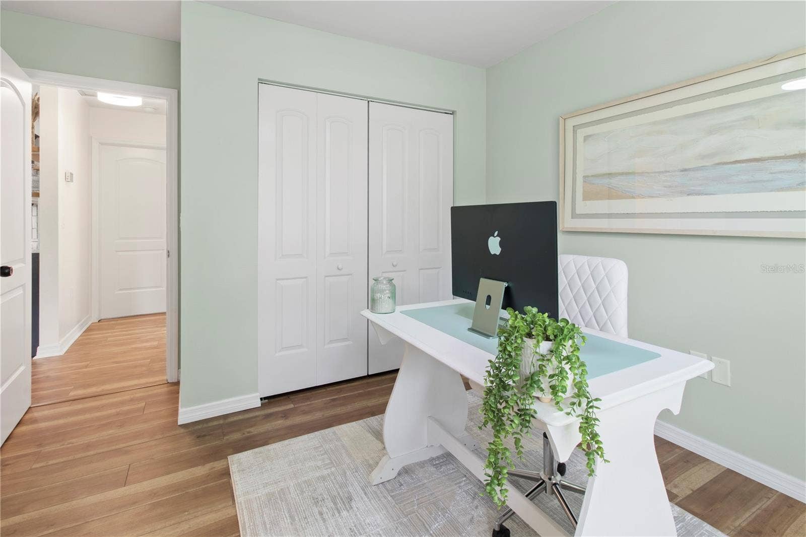 7905 55TH STREET E, Palmetto, FL 34221 BEDROOM 2 W/BUILT-IN CLOSET SYSTEM - SHOWN AS AN ELEGANT OFFICE SPACE