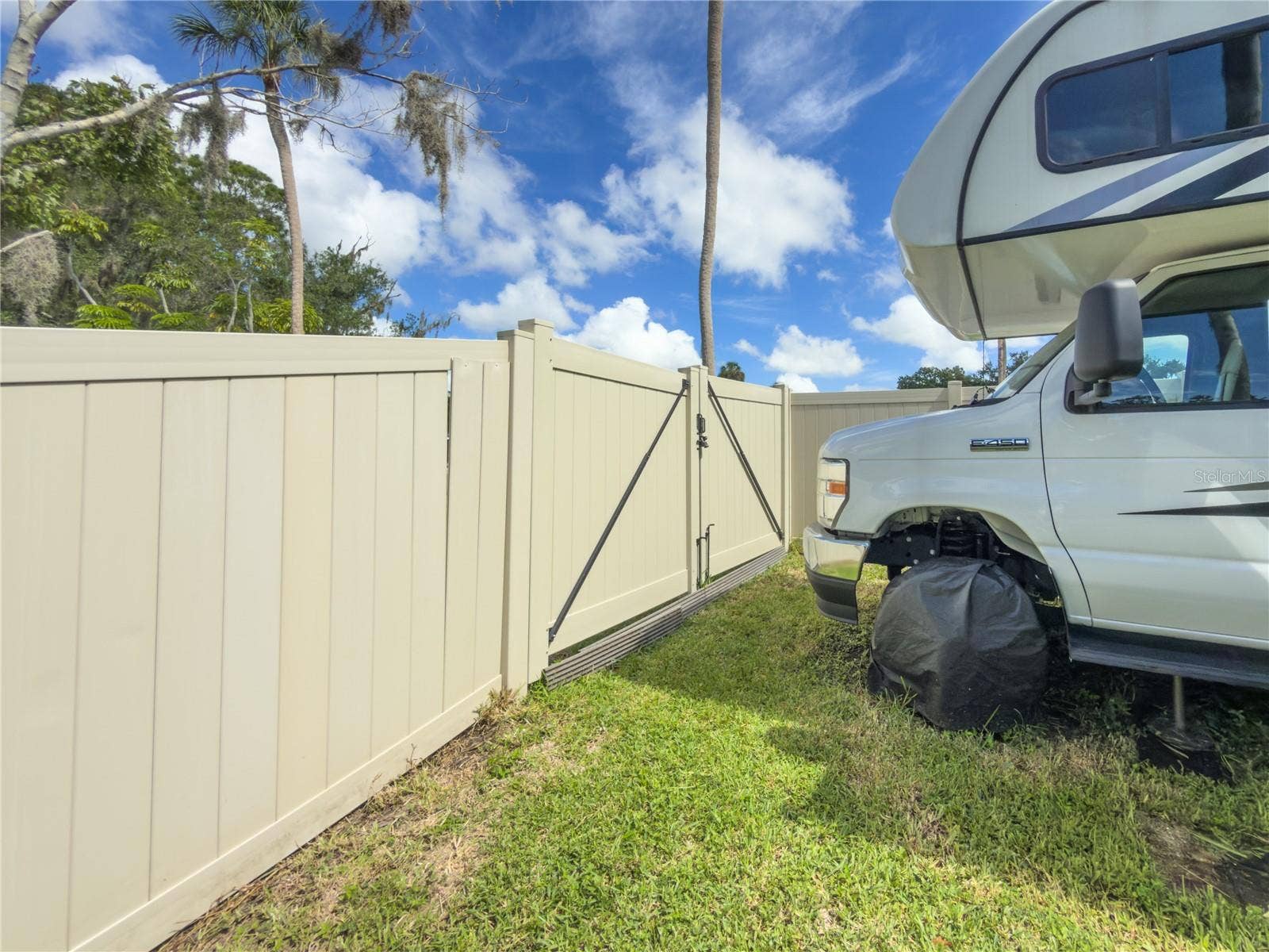 7905 55TH STREET E, Palmetto, FL 34221 SIDE YARD - CURRENTLY SUPPORTS A 30FT RV SPACE TO GATE