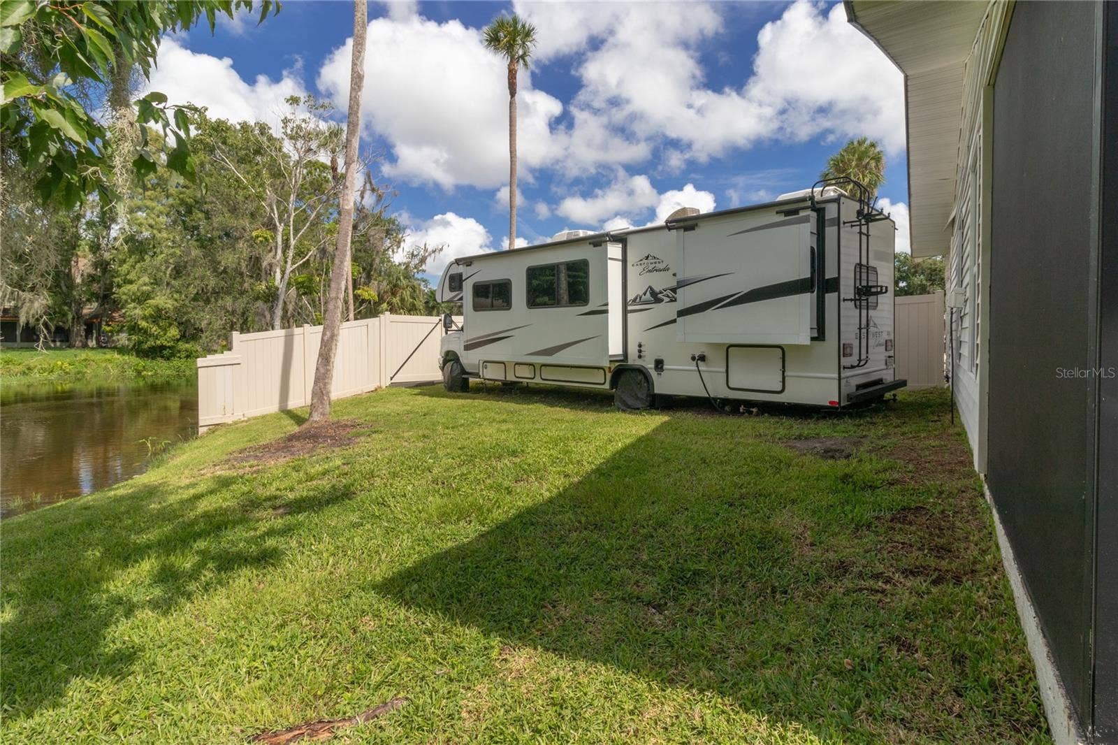 7905 55TH STREET E, Palmetto, FL 34221 SIDE YARD: POTENTIAL FOR MORE SQ FT, A POOL, OR PARK THE RV & BOAT