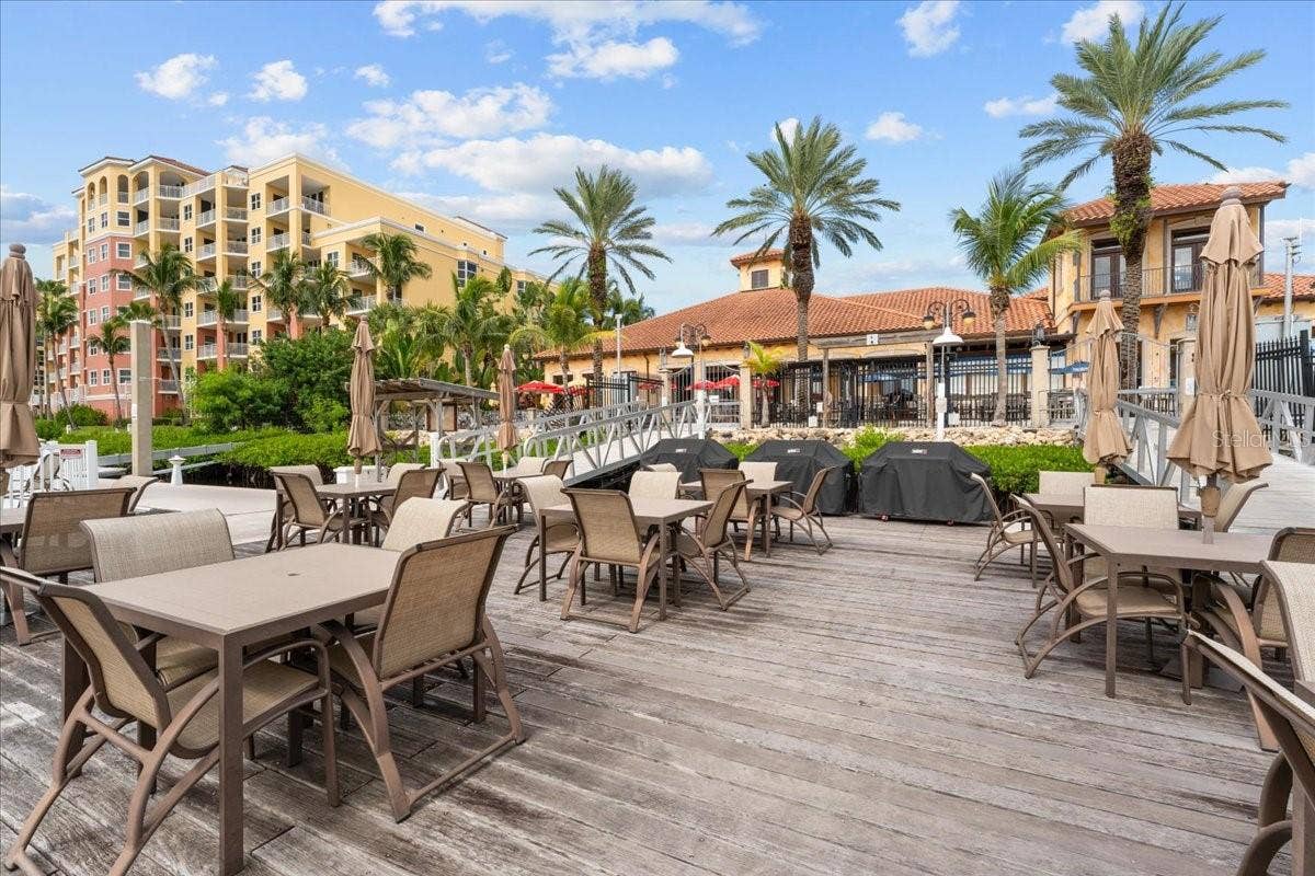 102 RIVIERA DUNES WAY, #C-24, Palmetto, FL 34221 Social area with 3 grills