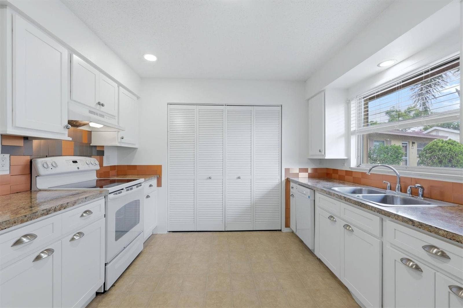 4538 PAWNEE TRAIL, #197, Sarasota, FL 34233 Inside laundry closet and pantry space