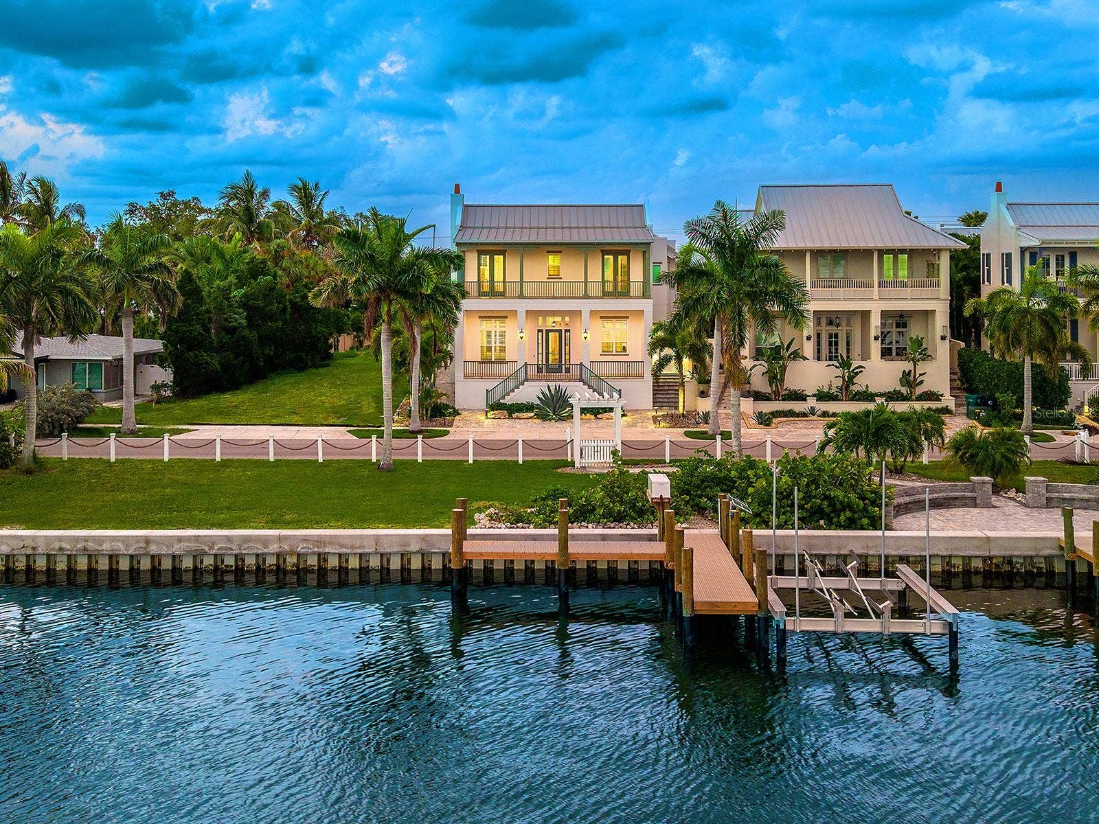4024 11TH STREET COURT W, Palmetto, FL 34221 Take advantage of the largest lot in Redfish Cove with 3 bedrooms, 3.5 baths, a caged and heated saltwater pool, in-law suite, oversized garage, and deeded dock with a covered boat lift beside a 2026 seawall