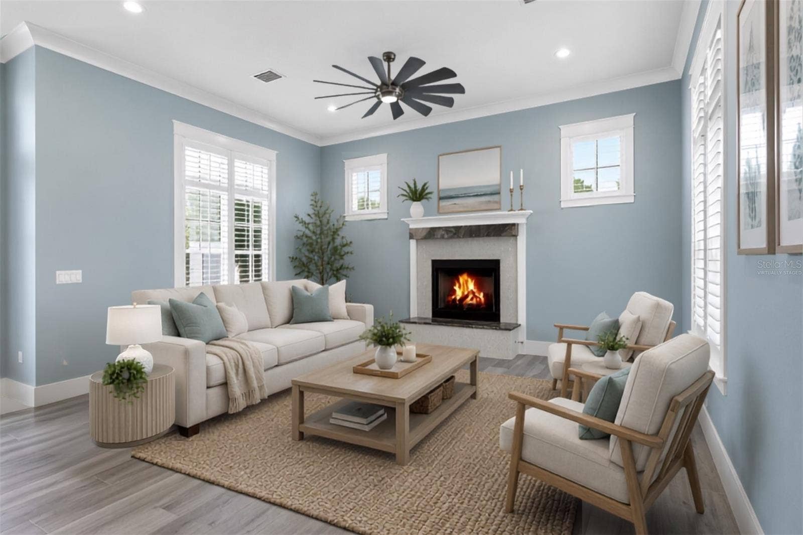 4024 11TH STREET COURT W, Palmetto, FL 34221 Living space on ground floor. A light-filled retreat with plantation shutters centered around a custom granite gas fireplace, perfect for unwind-and-relax evenings. Virtually staged.