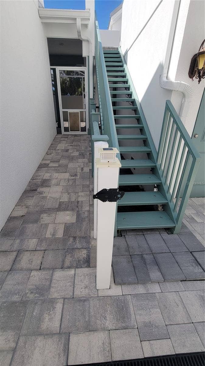 4024 11TH STREET COURT W, Palmetto, FL 34221 Staircase to in-law suite and door to pool
