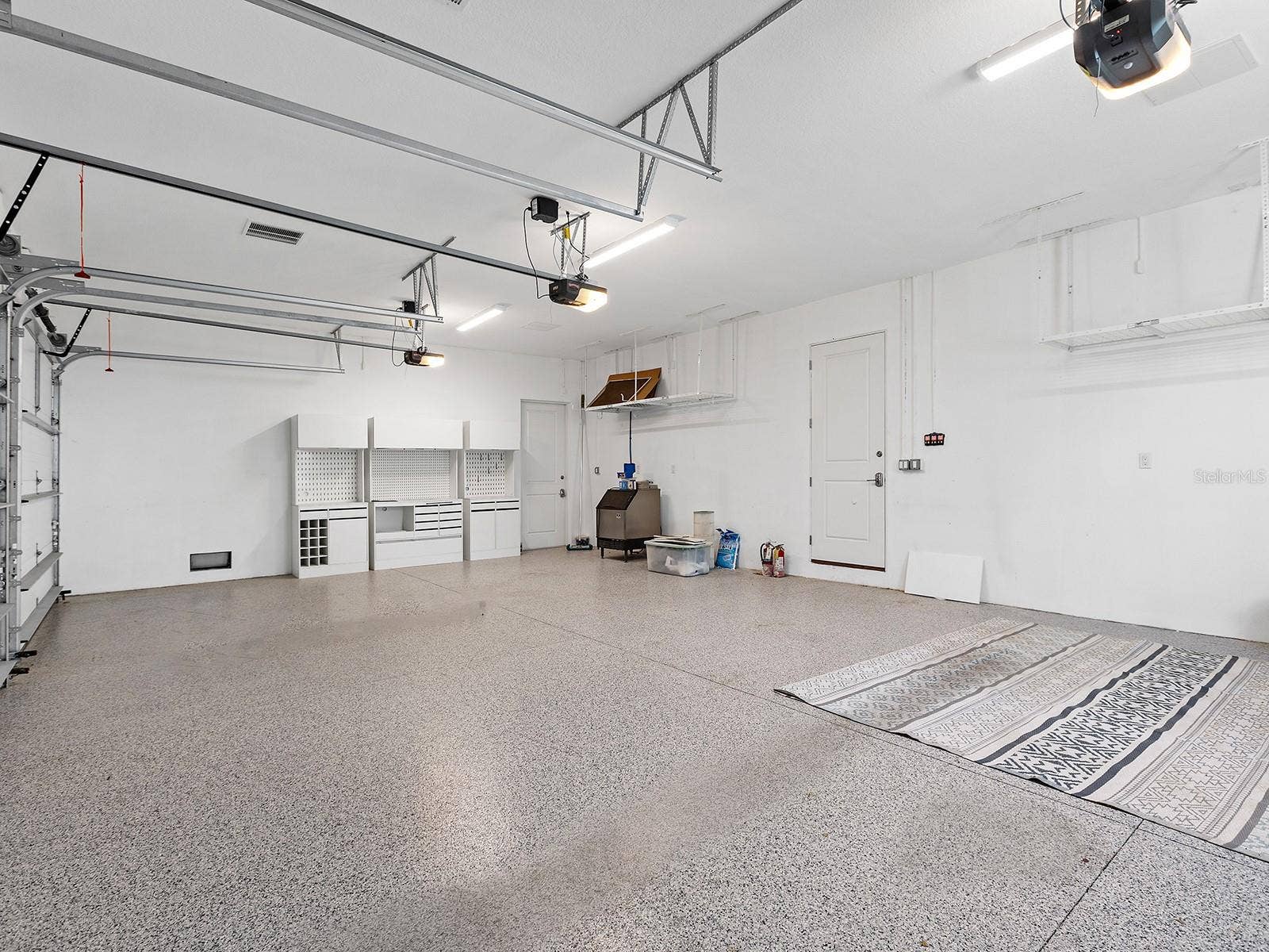 4024 11TH STREET COURT W, Palmetto, FL 34221 Immaculate garage with epoxy flooring, topped by a spacious, nearly 800-square-foot interior in-law suite complete with a full bathroom