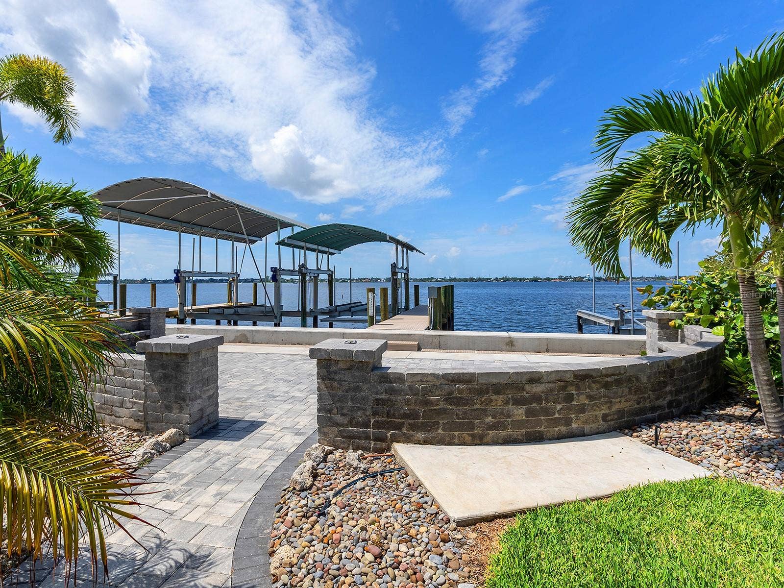 4024 11TH STREET COURT W, Palmetto, FL 34221 Enjoy cocktails on your paver terrace leading directly to the new dock equipped with water and electricity