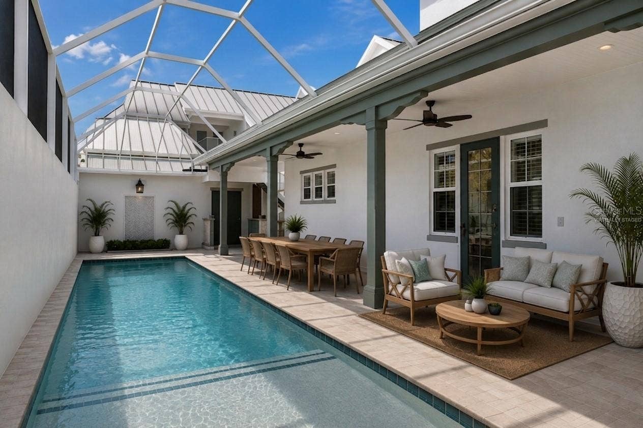 4024 11TH STREET COURT W, Palmetto, FL 34221 Virtually staged outdoor living oasis, featuring pool deck access to the main-floor primary bedroom (to the right)