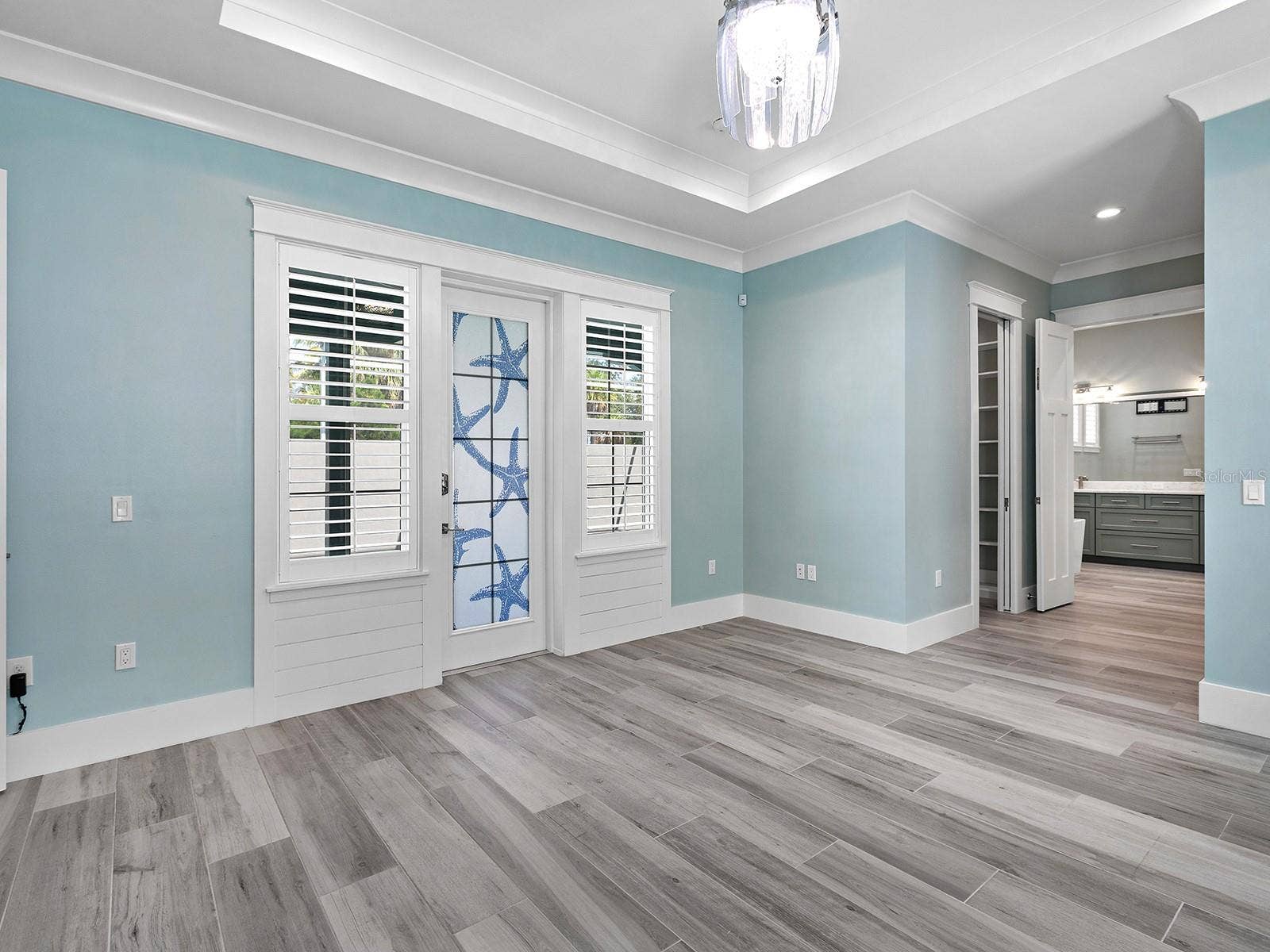 4024 11TH STREET COURT W, Palmetto, FL 34221 From your ground floor primary bedroom, walk outside to a covered space on the nearly 70-foot pool deck