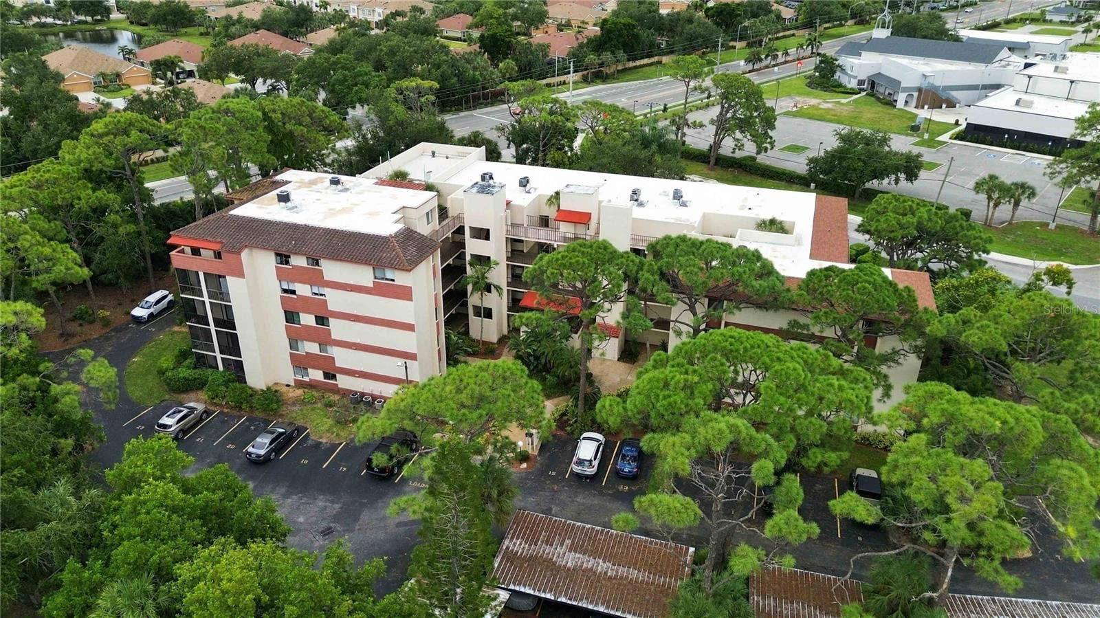 7500 40TH AVENUE W, #105, Bradenton, FL 34209 Exterior aerial view of the front of the building.