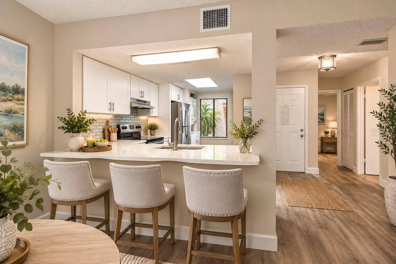 7500 40TH AVENUE W, #105, Bradenton, FL 34209 Kitchen and Foyer - Virtually staged