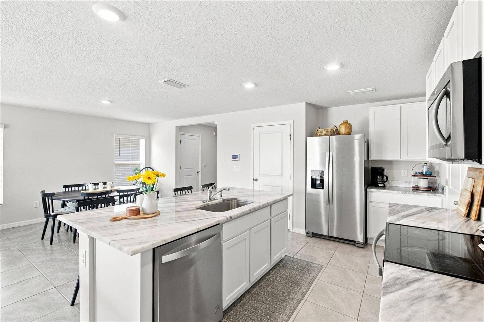 6118 DISTANT HAZE PLACE, Palmetto, FL 34221 Bright kitchen, replete with cabinetry and storage